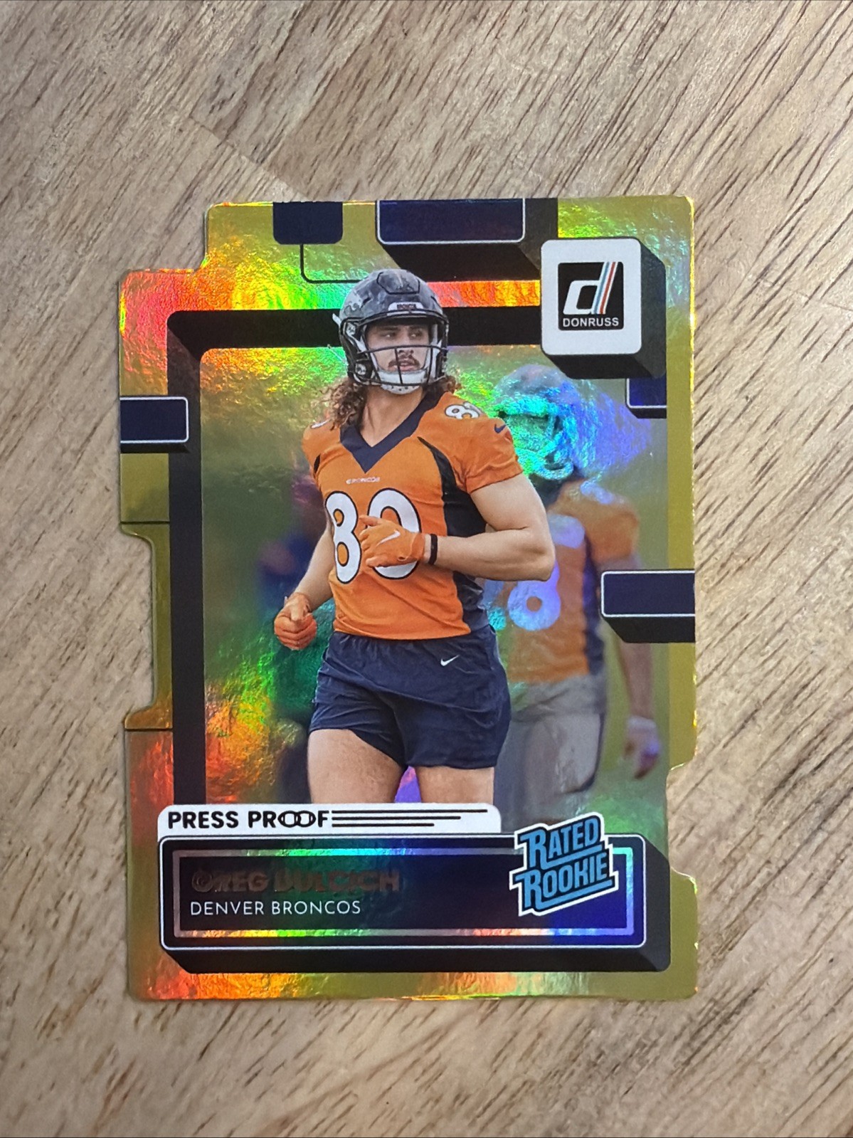 Greg Dulcich 2022 Panini Donruss Rated Rookie #385 Press Proof Gold Die-Cut /25