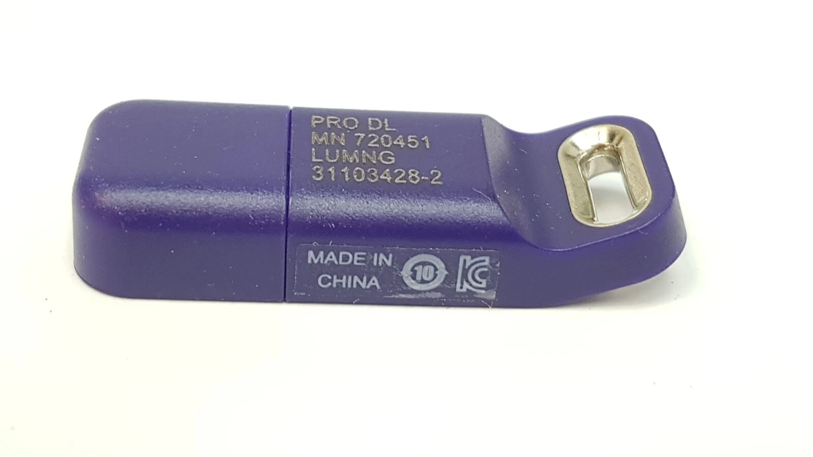 Angled view of the KT-10039510 USB key with metal key ring and MADE IN CHINA mark