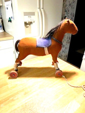 EARLY 1900S MADE BY THE STEIFF COMPANY FELT HORSE PULL TOY ON WOODEN WHEELS