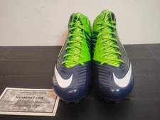 MARSHAWN LYNCH SIGNED SHOES ! AUTHENTICATED AT MILL CREEK SPORTS !!