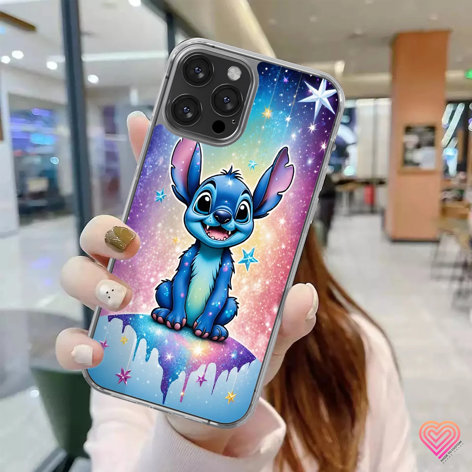 Stitch phone case with blue printed glitter design, glossy finish