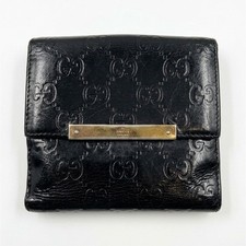 Gucci Black GG Embossed Logo Bifold Wallet Snap Closure Gold-Tone Bar Credit