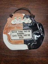 1994 Smoky Mountain Pottery ceramic cat and dog wall plaque.