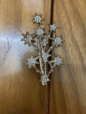 Hair clips featuring a dart topped tree