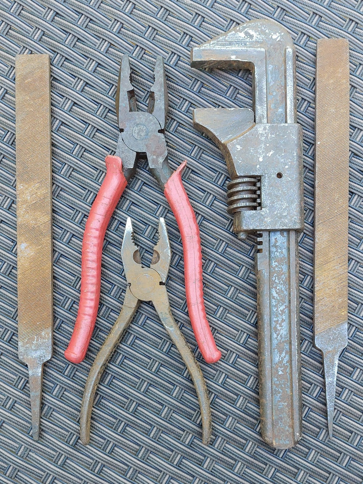 Set of vintage tools; adjustable spanner wrench + 2 pairs of pliers & 2 files