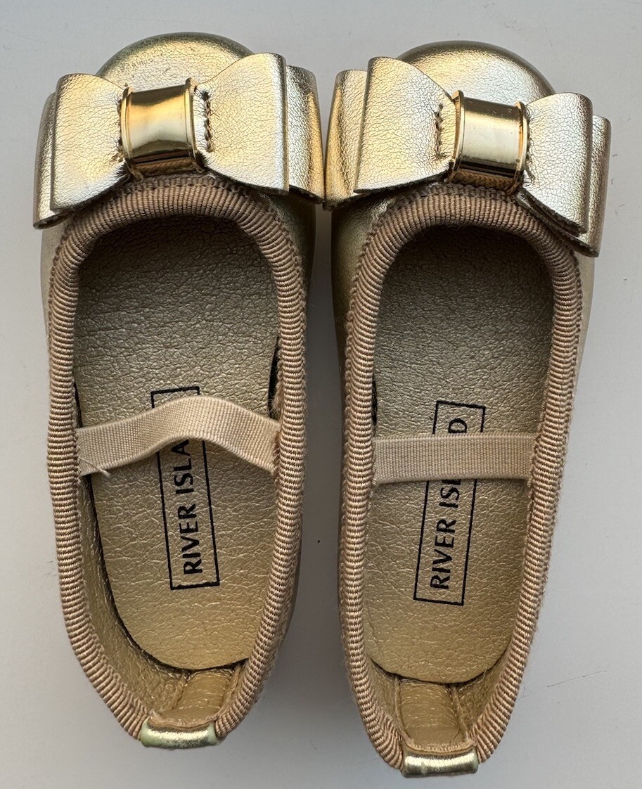 River Island Mini Girls Gold Bow Detail Ballet Pumps UK