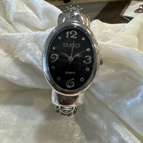 a Studio Time Women's Black Floral Silver-Toned Cuff Bangle Watch