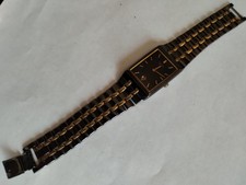 Men's Seiko 7N39-5A29 striking black and gold face and strap
