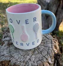 MUD PIE ~ "OVER SERVED" CERAMIC RAISED TENNIS RAQUET 12 0z. PINK INTERIOR MUG