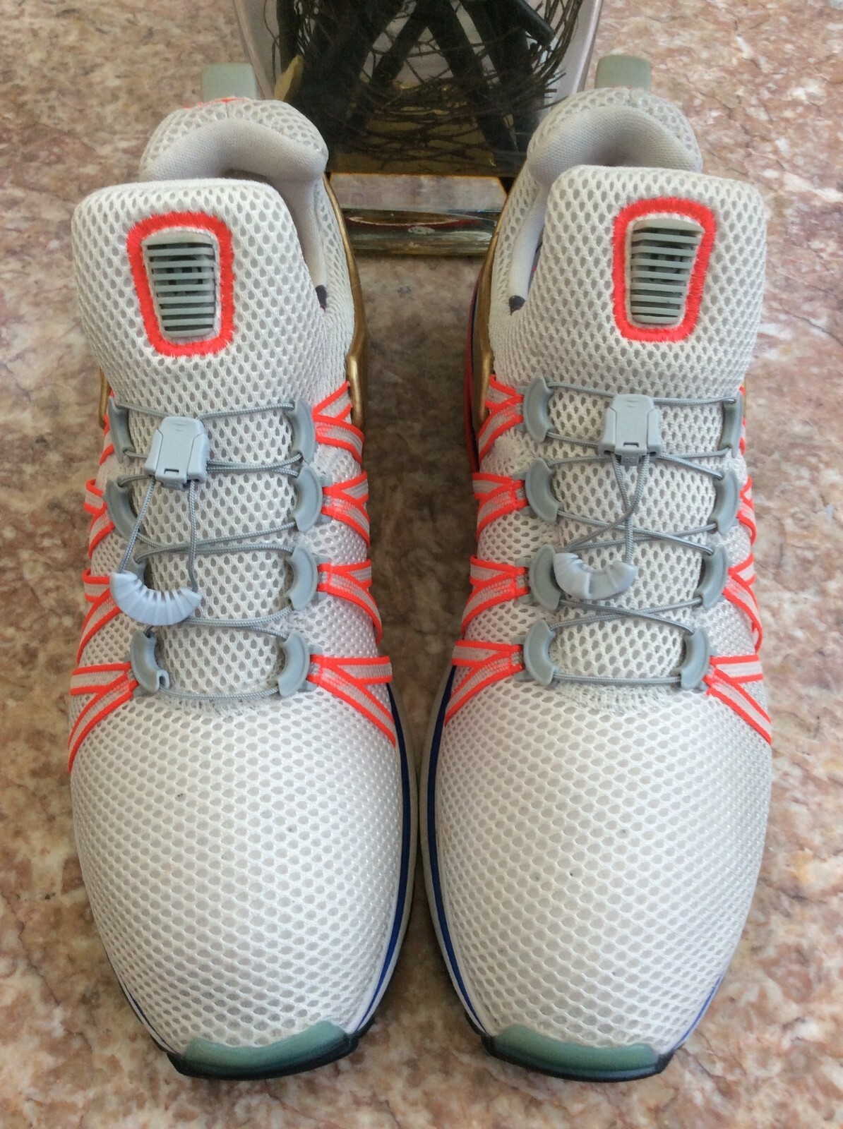 nike shox gravity vast grey metallic gold