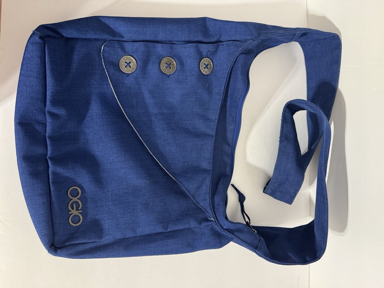 This item is an OGIO Brooklyn tablet purse in a blue colorway