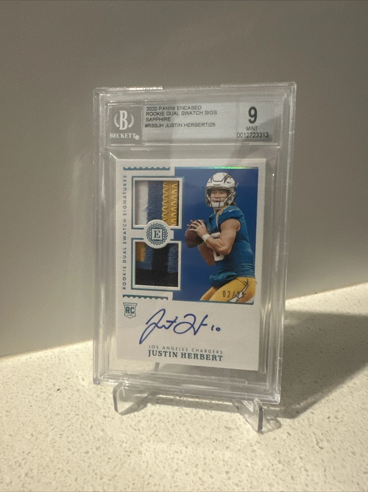 Justin Herbert Panini Encased Rookie Dual Swatch Signatures #RSSJH Sapphire