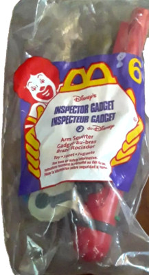 Inspector Gadget Arm Squirter.  #6 McDonald s Toy 1999.  New in package. 