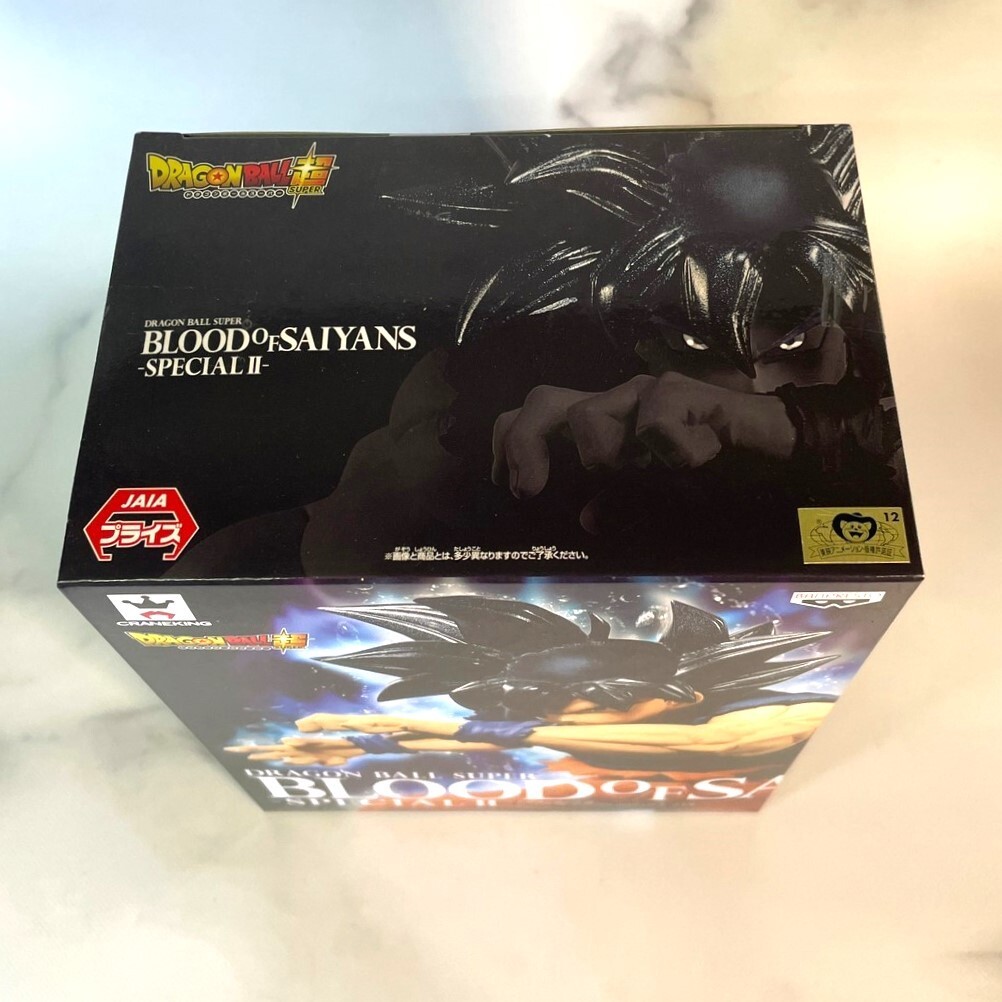 Banpresto Super Saiyajin Son Goku: ~ 20 cm Dragonball Z x Sangue dos  Saiyajins ~ Estatueta + 1 pacote oficial de cartas colecionáveis de  Dragonball (38747)