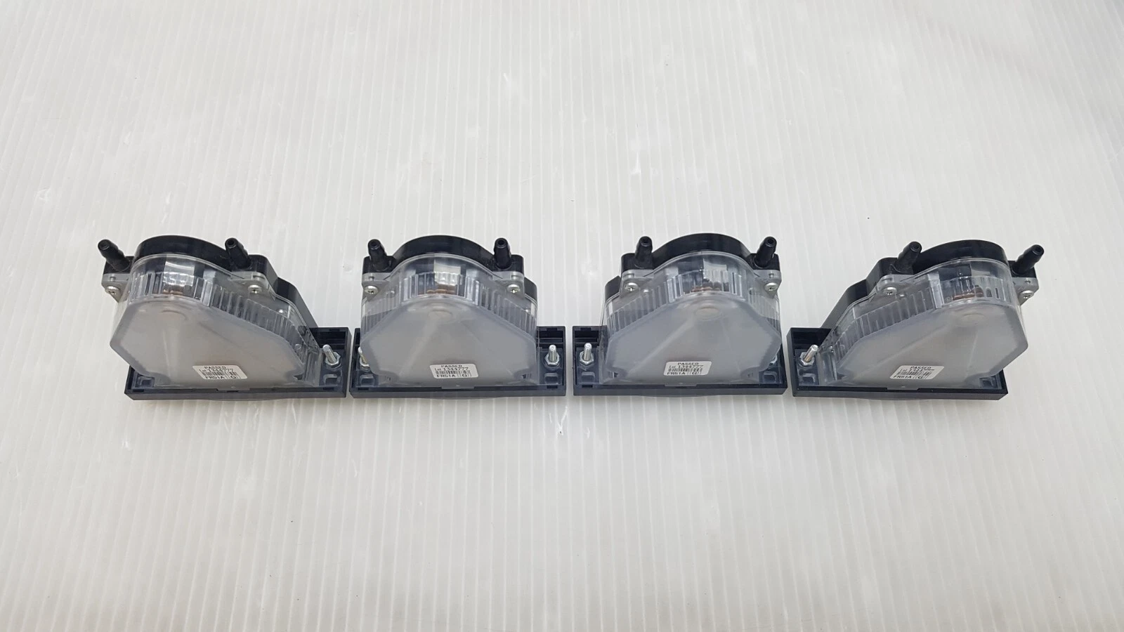 Four Manostar FR51A gauges from the top showing the tube tap nozzles