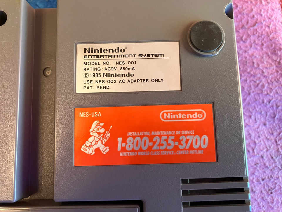 An untouched closet-find NES still wearing its original repair sticker — this is the kind of time-capsule vintage find that makes retro collectors lose their minds.