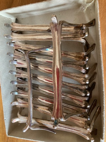 Suite de 8 porte couteaux en métal argenté maison CHRISTOFLE modèle