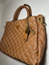 Image of 100% Authentic Guess Cessily Girlfriend Satchel in a quilted design and leather.
