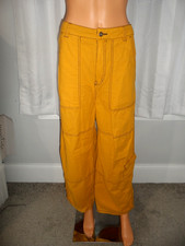 Cool Free People size 4 gold yellow wide leg cargo pockets navy stitching