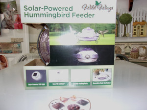 WILD WINGS Solar-powered Hummingbird Feeder w/solar powered light.