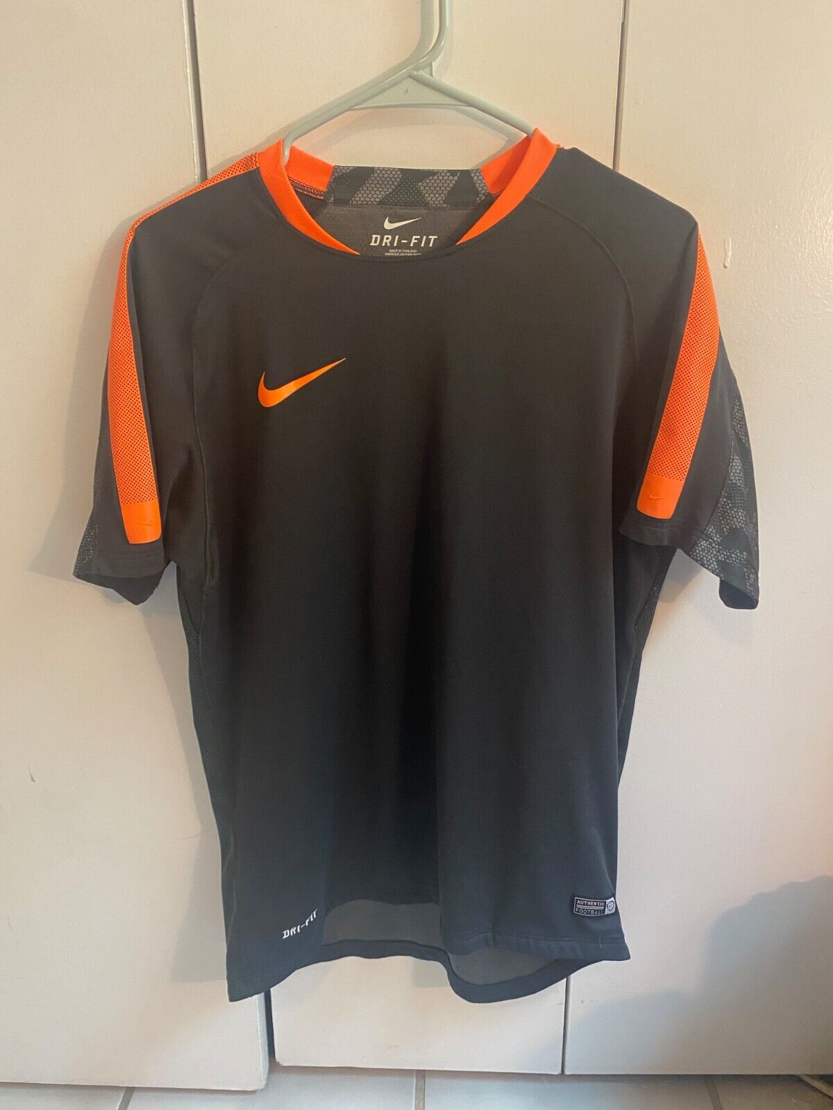orange nike football shirt