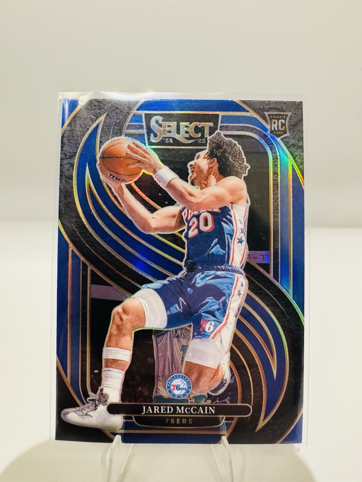 2024 Panini Select - Premier Level Jared McCain #184 Blue Prizm (RC) - 76ers
