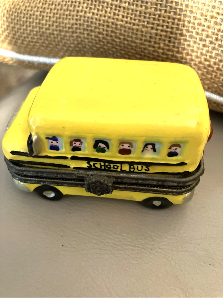 Hand-painted porcelain school bus that opens up — charming vintage kitsch with real nostalgic personality.