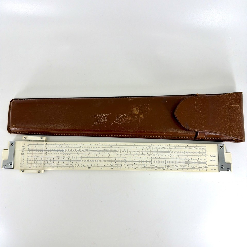 A genuine bamboo slide rule from Japan with its original leather case — a beautifully tactile pre-digital calculator that doubles as a desk art piece.