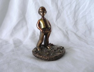 whistling boy figurine