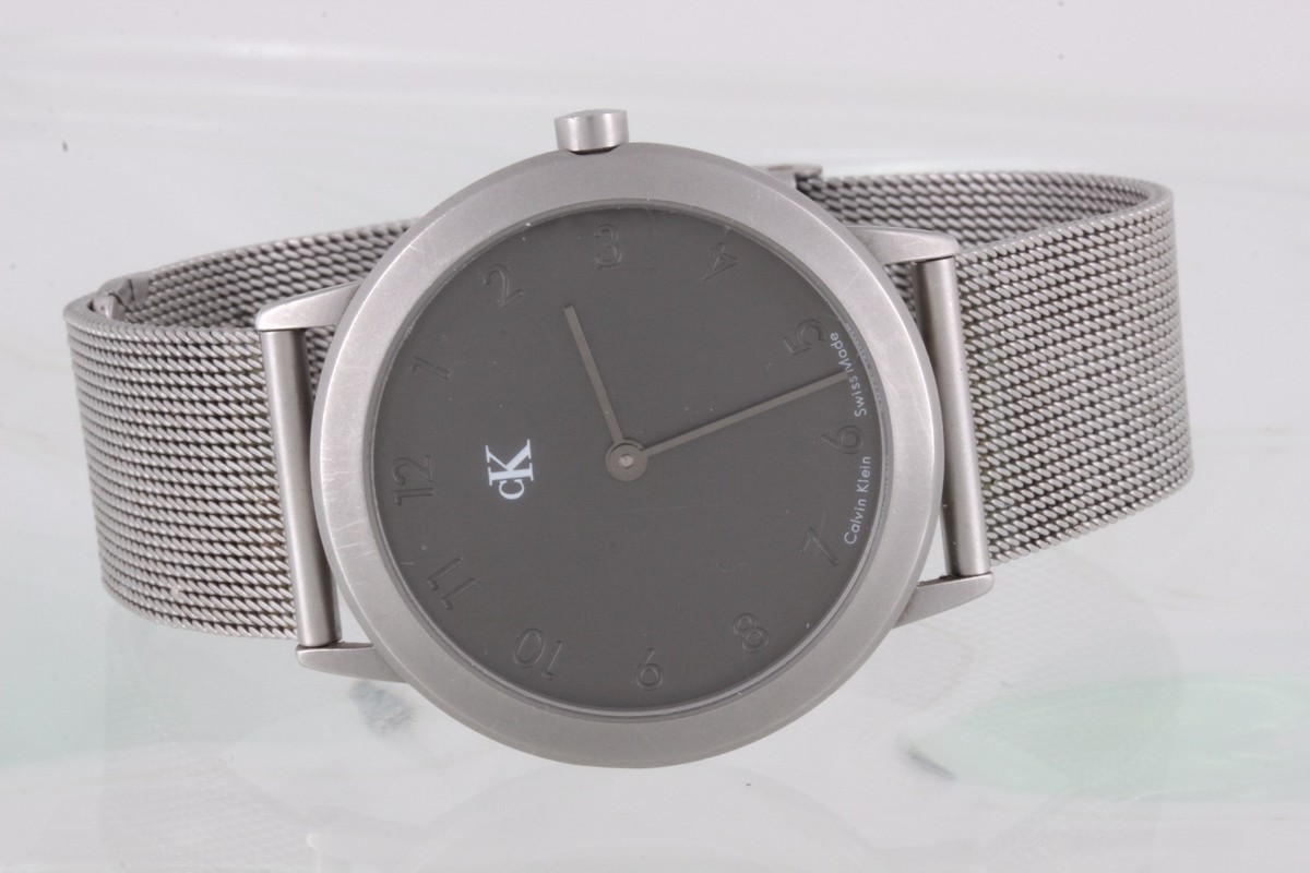 Vintage NWT Calvin Klein Swiss Mode Gray/White Watch with Mesh Style Woven Band Calvin Klein Swiss Made Wristwatches for sale - eBay main image 2