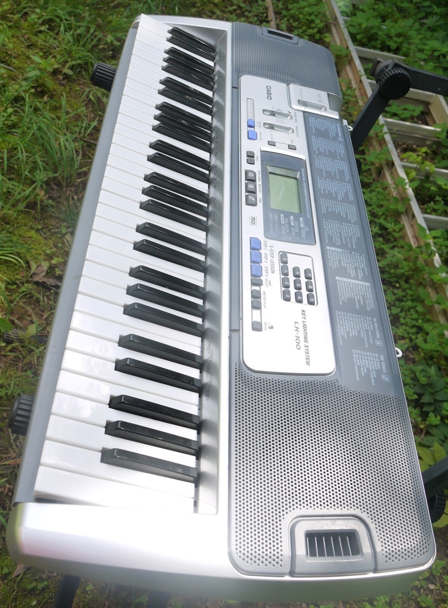 Casio LK-100 Keyboard 61 Key Lighted Key 100 Songs 100 Tones 50