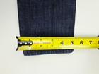 Vince Dylan skinny women’s 28x31 blue denim jeans with five pockets, made in the USA, on a gray fabric background.
