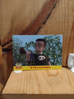 Disney Pixar: Topps Toy Story Card:  #4. IN SID'S CLUTCHES!  Q4