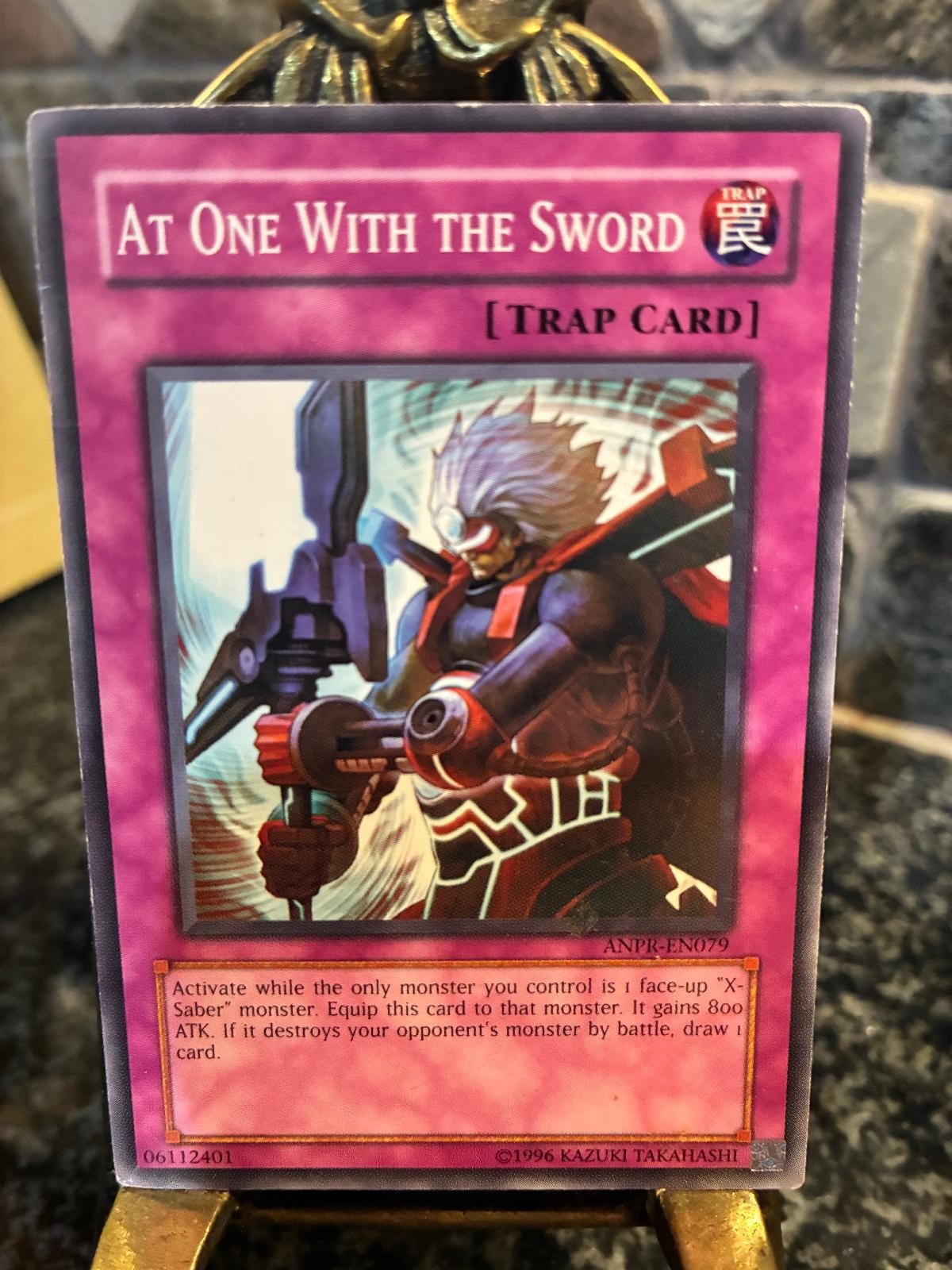 At One With the Sword ANPR-EN079 YuGiOh Ancient Prophecy trading card — raw and PSA graded price guide