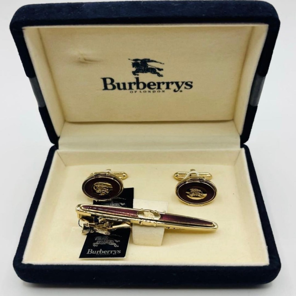 A vintage Burberry tie clip and cufflink set with the iconic knight-horse logo sourced from Japan — authenticated heritage menswear at a fraction of boutique price.
