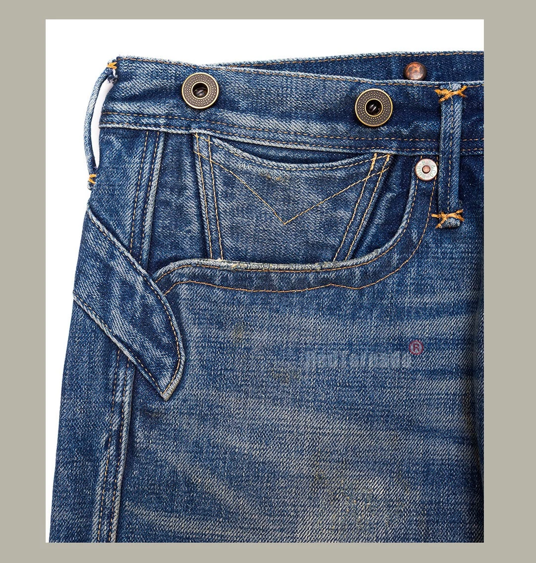 Red vintage blue denim jeans with wide lapels, button closure, and front rip details on waistband.