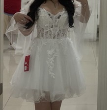 Dancing Queen elegant white lace dress.Features sheer sleeves and floral details
