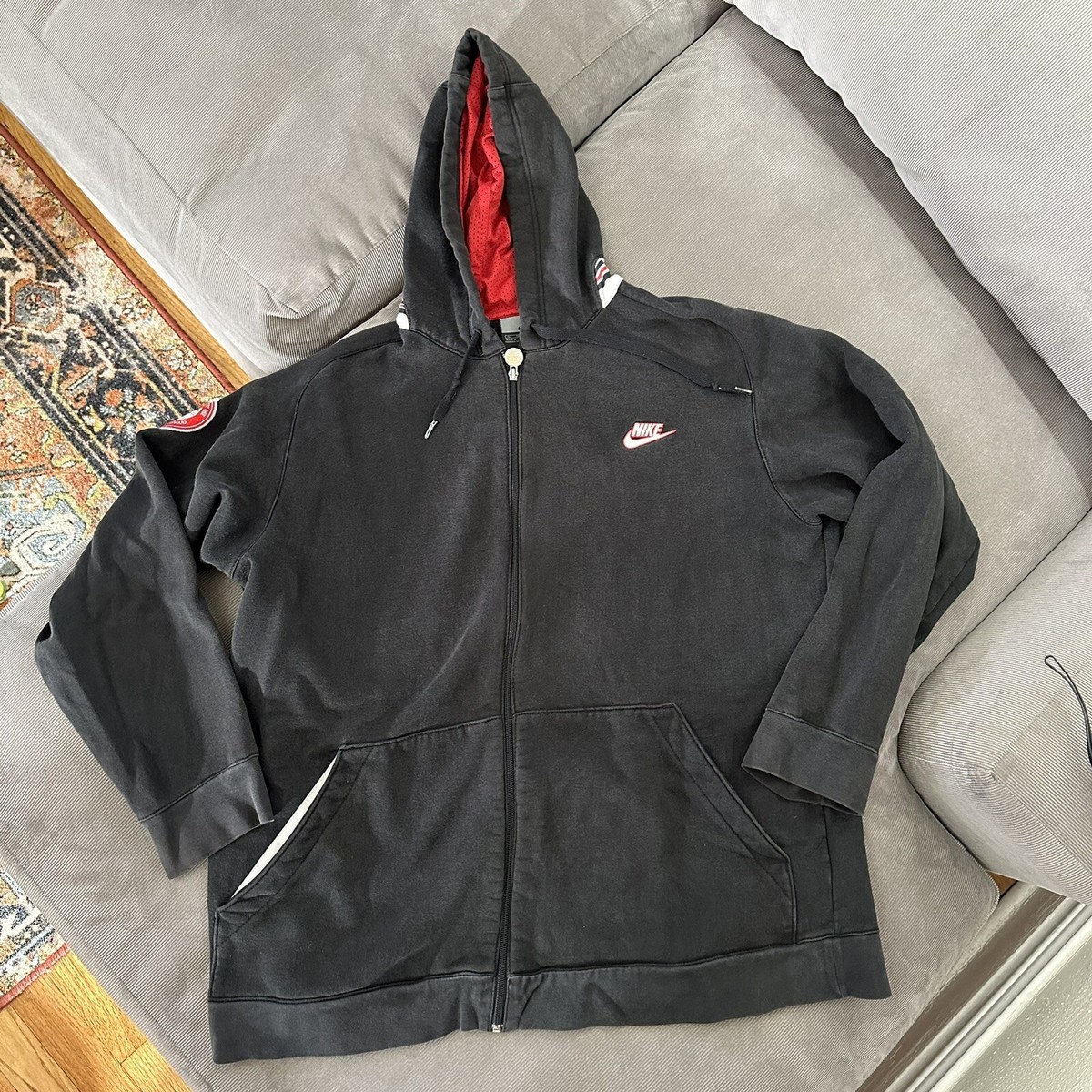 black nike sweatshirt with red tick