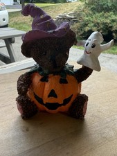 Halloween Bear In Pumpkin Suit And Witch Hat Holding A Ghost.