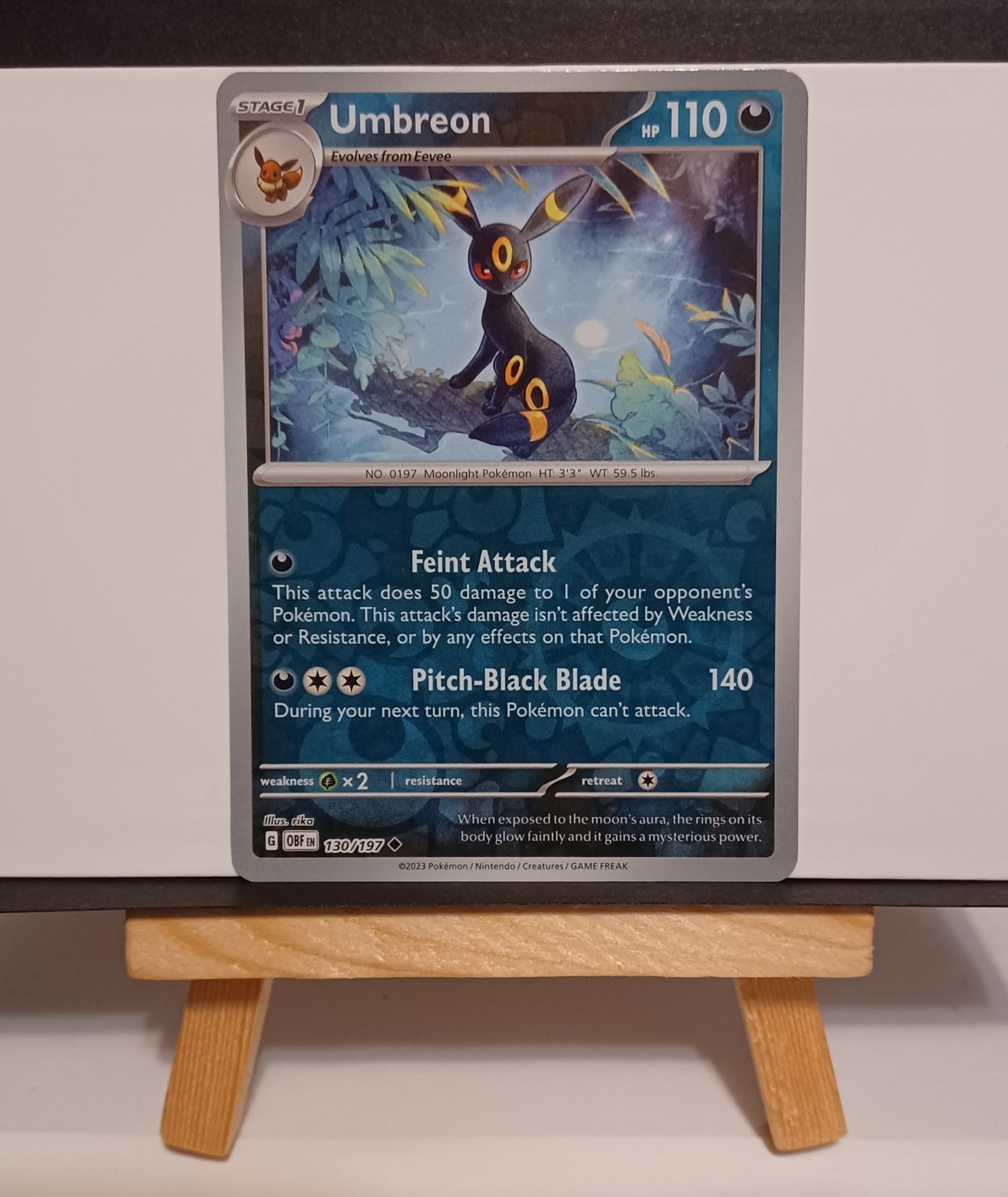 Umbreon Reverse Holo 130/197 SV03: Obsidian Flames Uncommon NM/LP