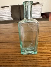 Clean late 1800s paneled aqua medicine bottle with tooled lip