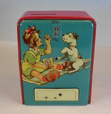GEOBRA Blechspielzeug Spardose M&auml;dchen mit Hund rot/petrol mechanisch #3341