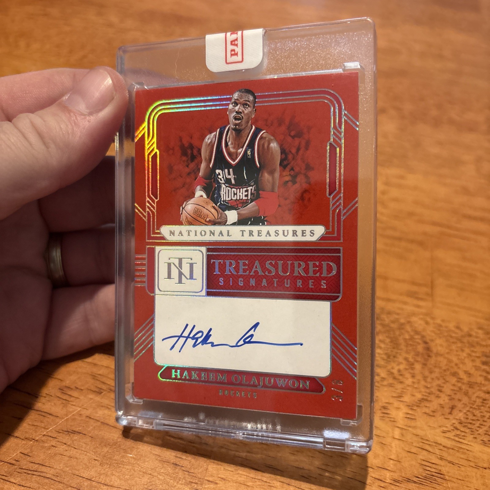2024-25 Panini National Treasures Hakeem Olajuwon treasured auto RED 3/8 on card view 7