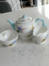 A GORGEOUS SHELLY LARGE TEAPOT,,WILD FLOWERS  4 TRIO SETS  HENLEY SHAPE CUPS 
