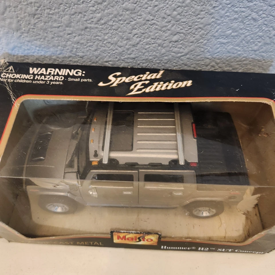 Coche diecast Maisto edición especial Hummer H2 SUT Concept 1:27 gris plata Foto 3 de 4