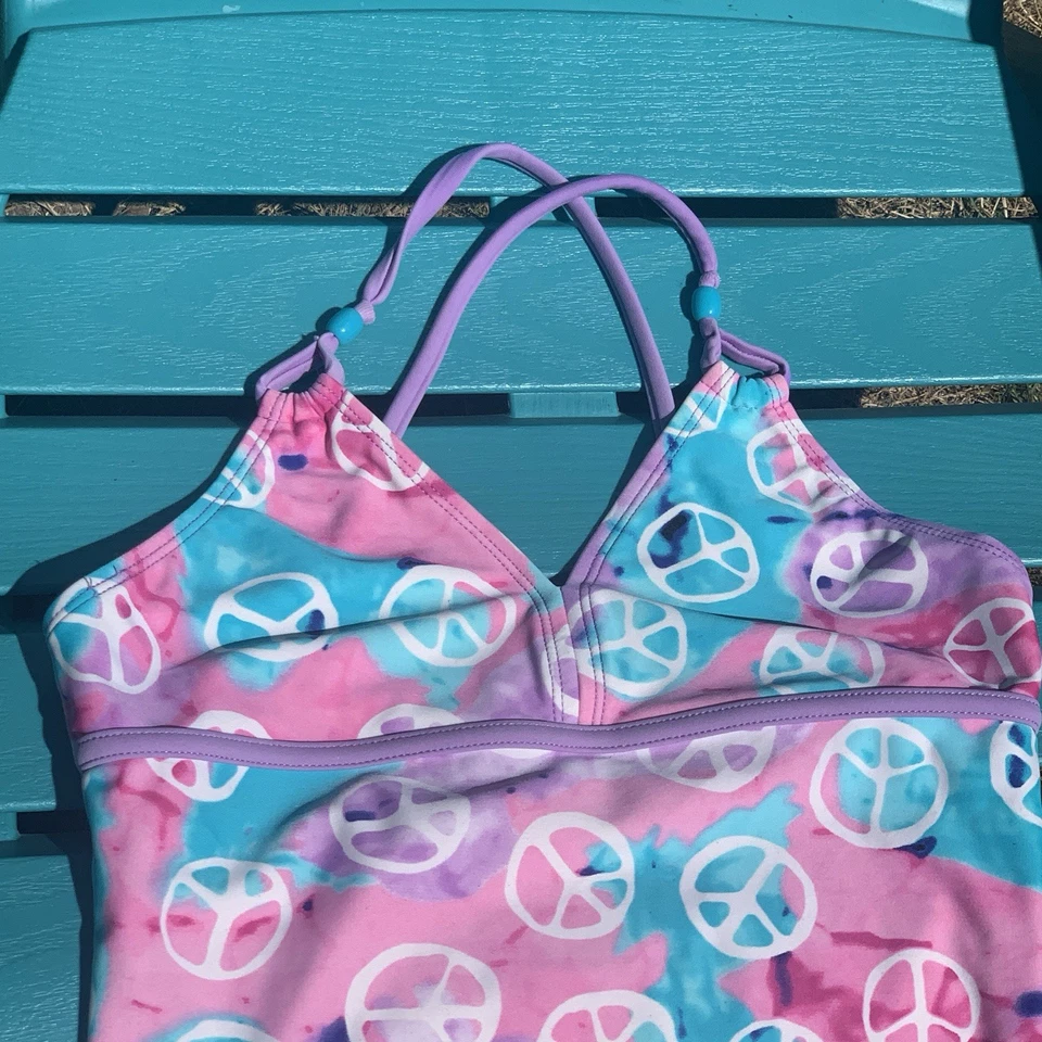 Traje de baño Xhilaration niños talla L (10-12) Peace de una pieza rosa lavanda manchado Foto 3 de 4