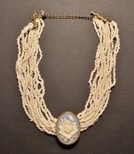 Vintage beaded multi-strand necklace with ivory rose cameo pendant