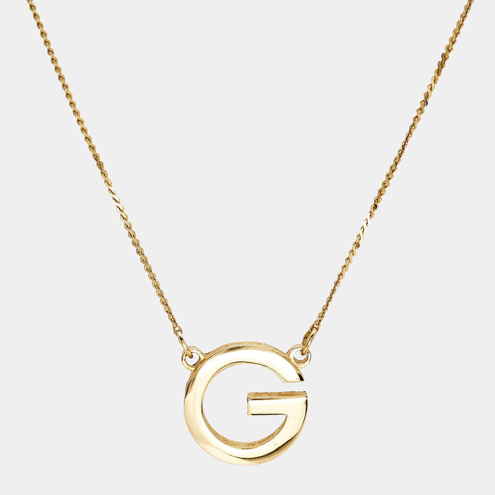 Givenchy Oval G Gold Tone Pendant Necklace