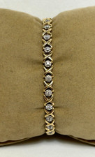 ELEGANT 10K YELLOW GOLD 1/4 ct tw DIAMOND XO TENNIS BRACELET 7"
