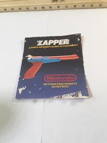 Nintendo NES Zapper Instruction Manual Booklet Only Has Some Damage On Cover.   